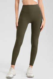 Olive green high-waist performance leggings with sculpting seams.