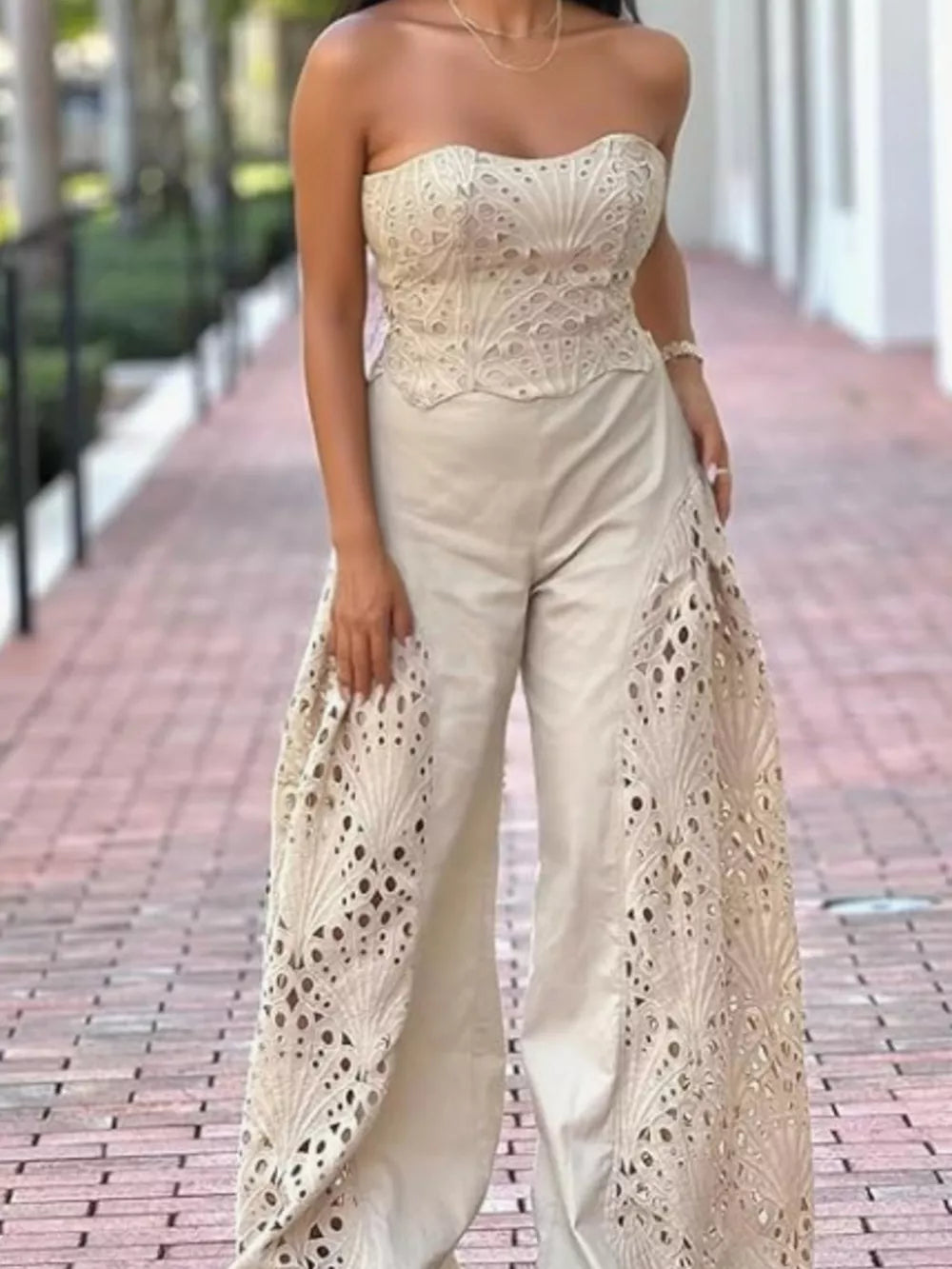 Apricot openwork strapless corset top and wide-leg pants set with intricate detailing.