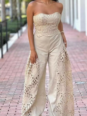 Apricot openwork strapless corset top and wide-leg pants set with intricate detailing.