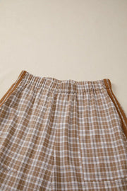 Plaid print casual pants in camel with drawstring waist and side stripe detail.