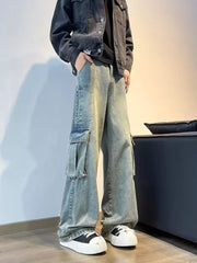 Vintage wash oversized wide-leg cargo jeans with distressed details and large side pockets.