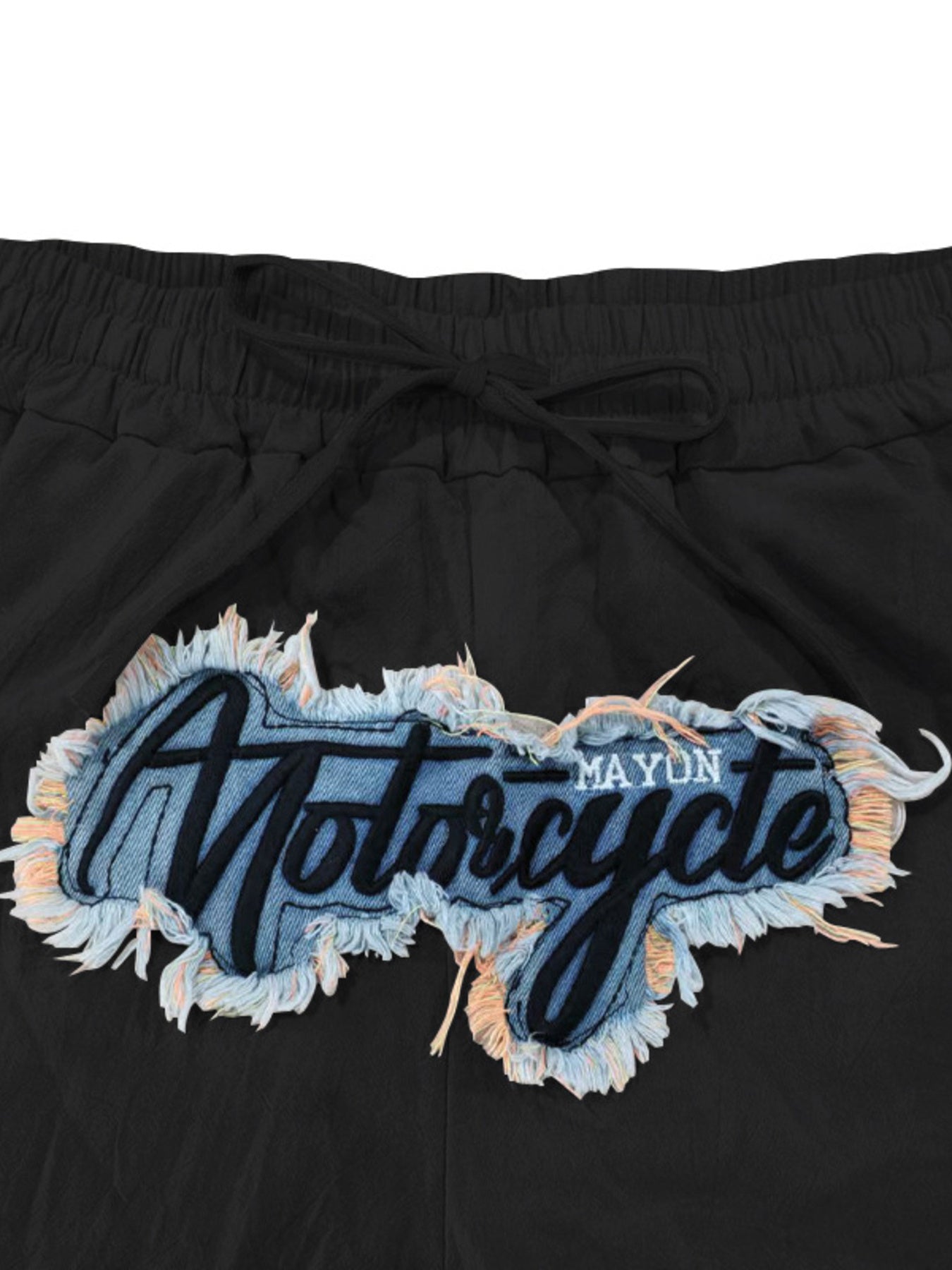 Black sweatpants with drawstring and embroidered motorcycle graphic patch.