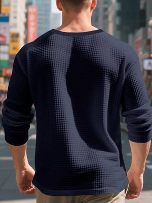 Men's navy waffle knit long sleeve undershirt with crew neck.