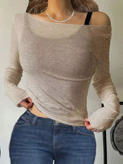 Apricot sheer long sleeve t-shirt with boat neck, styled with jeans.