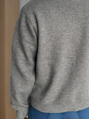 Gray ribbed knit cardigan with crew neck and button front detail