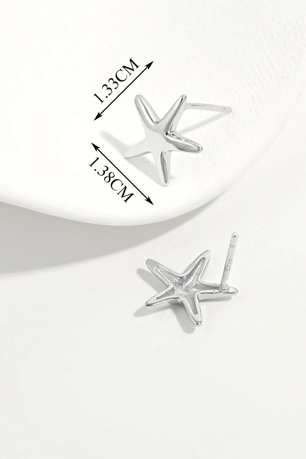 Silver starfish stud earrings with detailed measurements shown.