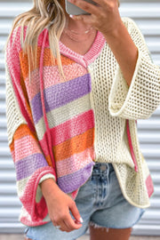 Colorblock knit hoodie with V-neck, featuring stripes in pink, orange, purple, and beige.