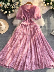 Pink lace puff sleeve dress with button front and ruffled neckline.