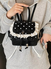 Black polka dot mini backpack with white lace trim and bow detail