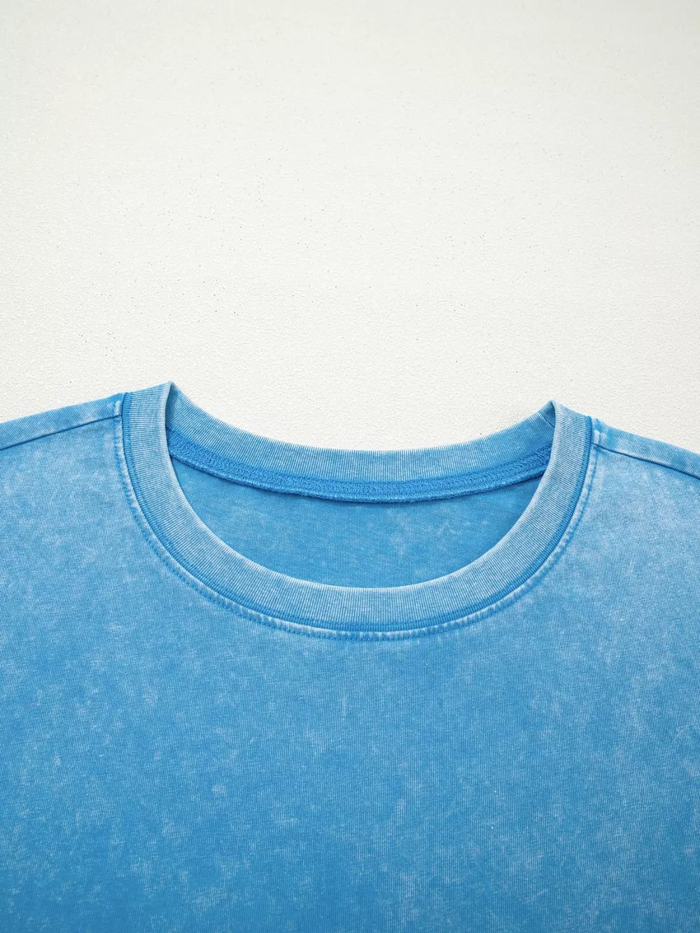 Mineral washed blue cotton crew neck t-shirt with a relaxed fit.