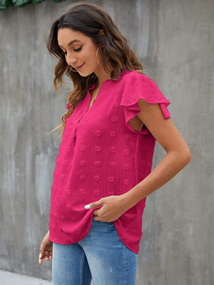 Hot Pink flutter sleeve Swiss dot blouse with V-neck and ruffle detail.