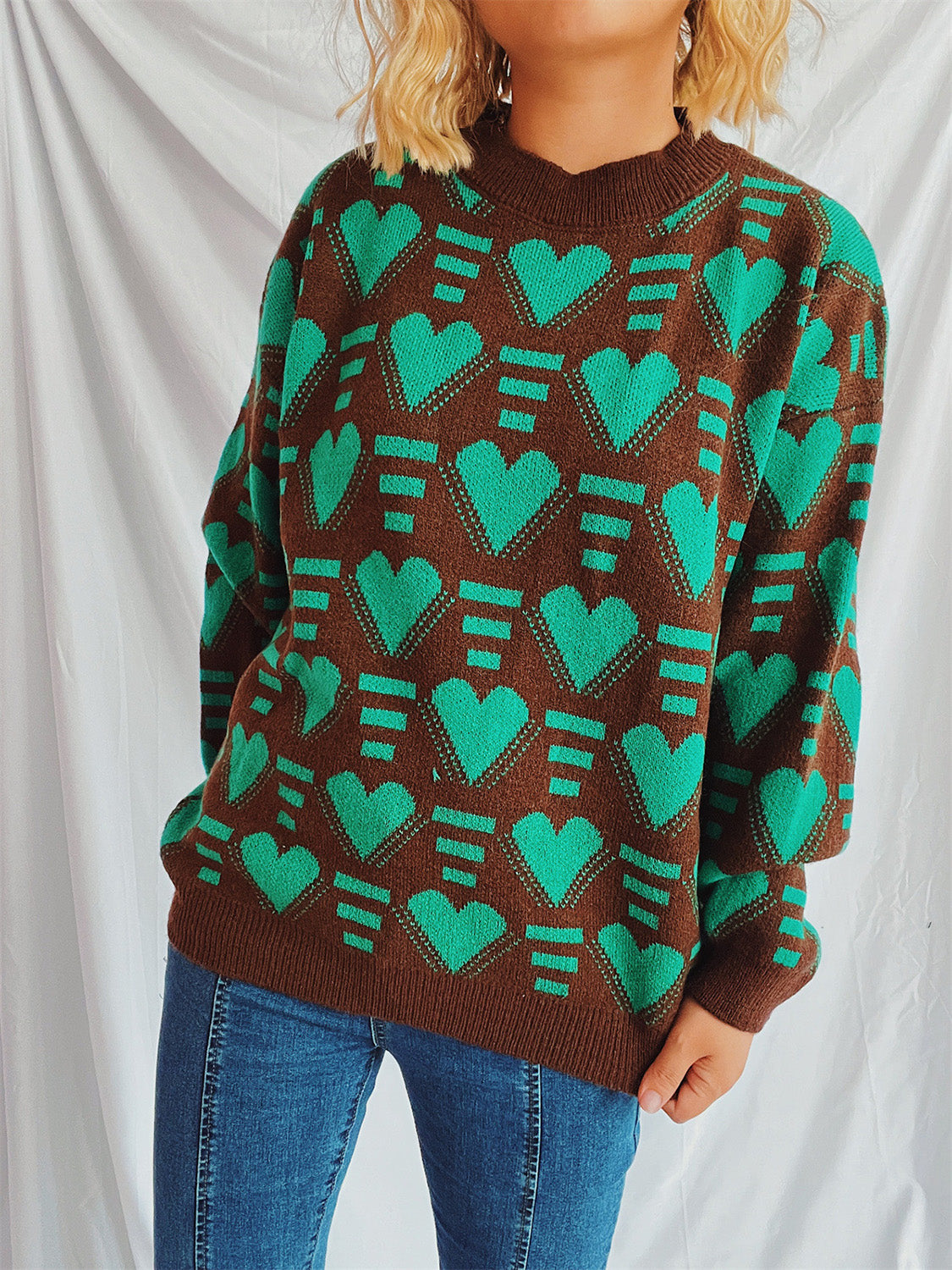 Brown acrylic knit jumper with allover neon green geometric heart pattern.