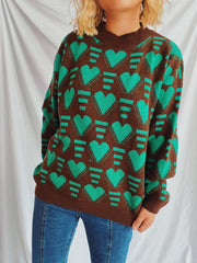 Brown acrylic knit jumper with allover neon green geometric heart pattern.