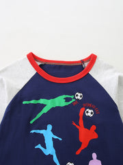 Baby long sleeve tee with colorful soccer players graphic and red trim.