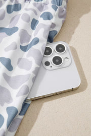 Camouflage print pajama pants in blue and grey with a white background, showing a side pocket detail.