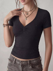 Chic black V-neck t-shirt with ruched detail and subtle sparkle