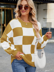 Checkerboard knit sweater in mustard and white with balloon sleeves and crew neck.