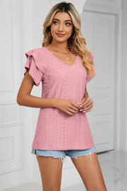 Blush pink eyelet knit blouse with flutter sleeves and V-neck.