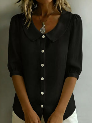 Black button-down shirt with puff sleeves and Peter Pan collar