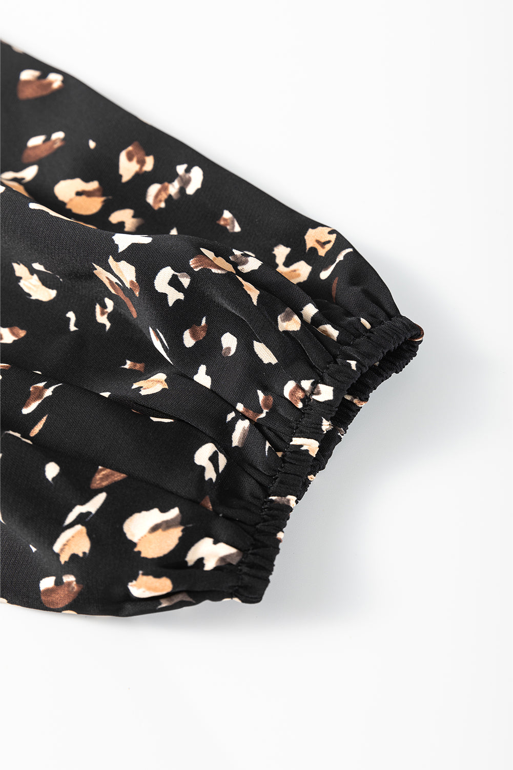 Black abstract print blouse with elasticated cuffs and gathered sleeve detail
