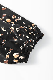 Black abstract print blouse with elasticated cuffs and gathered sleeve detail