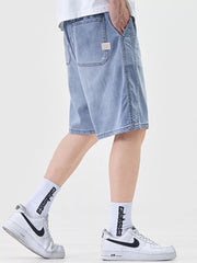 Light blue denim shorts for men, loose fit, casual style, with back pockets.