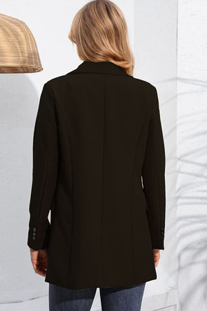 Black double-breasted tailored blazer with flap pockets and button cuff detail.