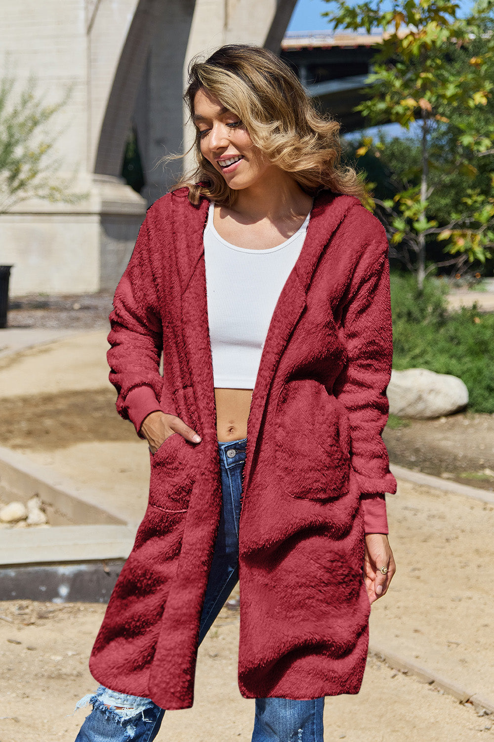 Plush hooded duster in Deep Red with thumbhole cuffs and pockets.