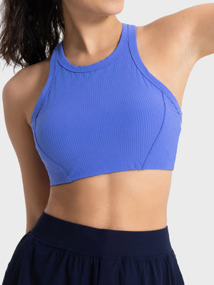 Blue ribbed racerback crop top with contour stitching and a high neckline.