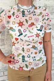Women's white mesh tunic top with colorful cowboy boots, hats, and western print.