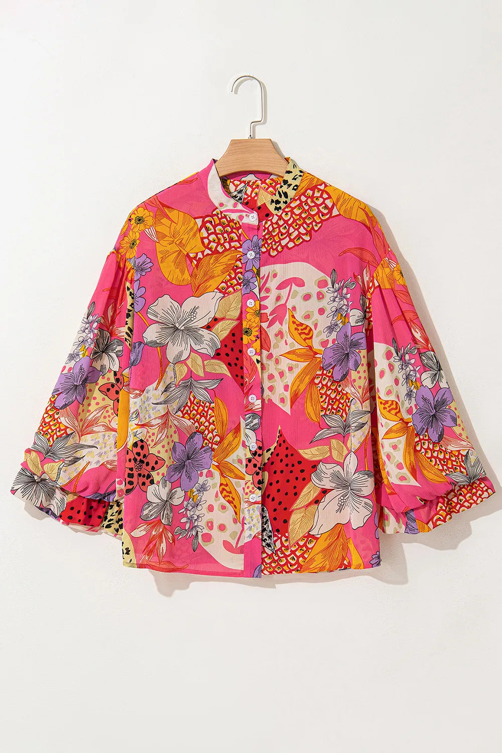 Patchwork floral blouson sleeve blouse in strawberry pink with a band collar and button front.