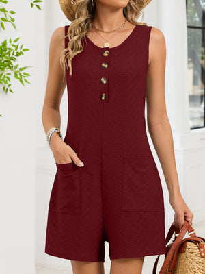 Burgundy sleeveless romper with button front and textured fabric.