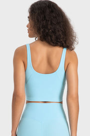 Light blue scoop neck crop top with wide straps and a cropped hem.