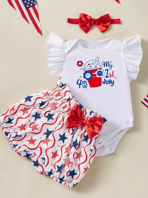 Baby 3-piece outfit with white bodysuit, red, white, and blue star print bloomers, and red bow headband.