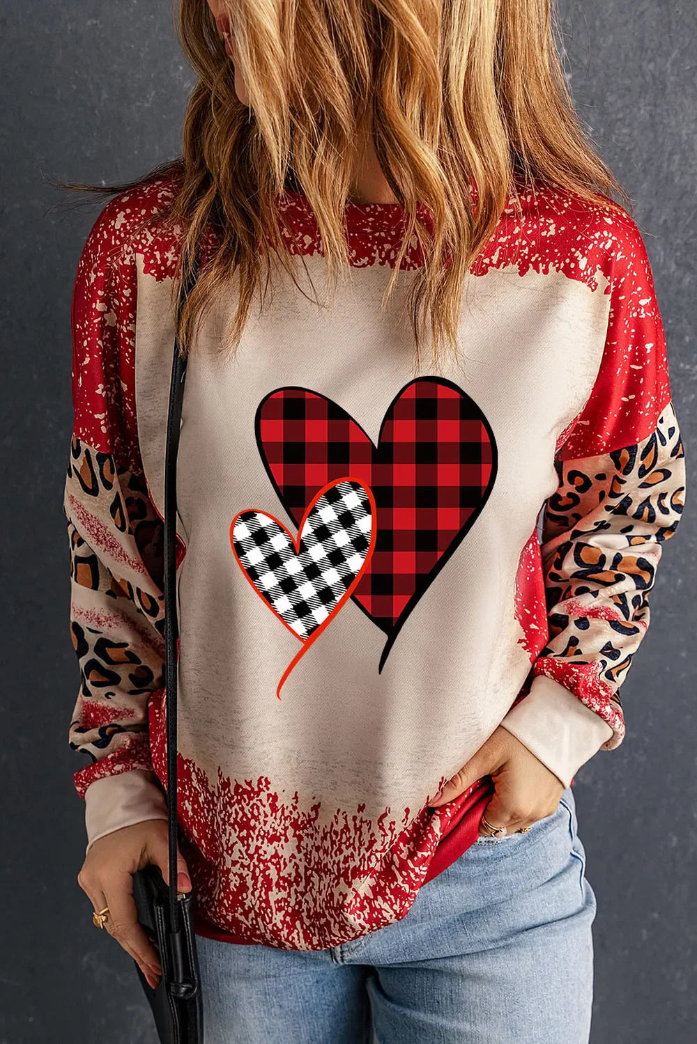Plaid Heart Graphic Leopard Sleeve Sweatshirt in Deep Red with bleach-splatter detail.