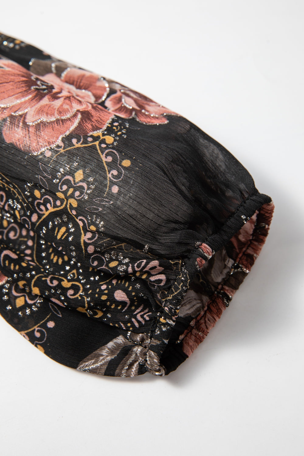 Black floral blouson sleeve top with metallic accents