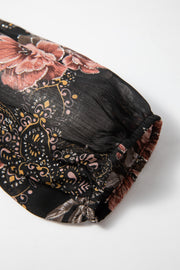 Black floral blouson sleeve top with metallic accents