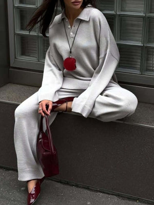 Grey knit polo collar sweater and wide-leg pants set with button detail.