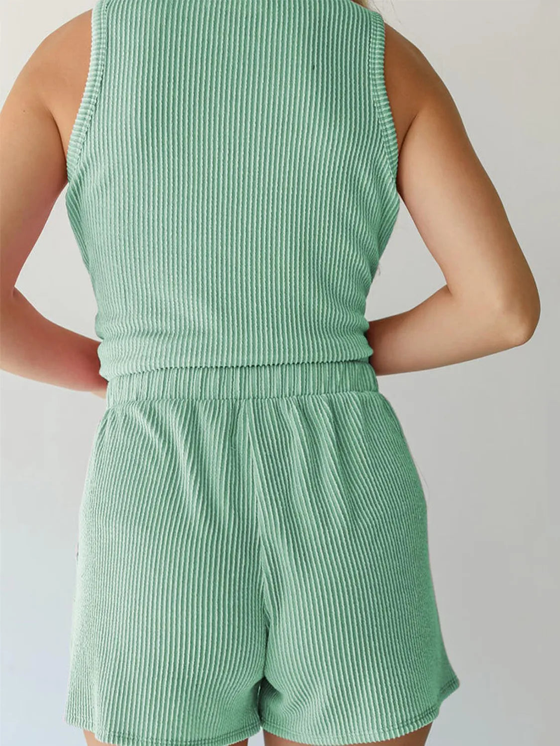 Sleeveless ribbed coord set in Gum Leaf green with elastic waistband shorts.