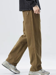 Men's olive loose fit drawstring sweatpants with a relaxed leg and front seam detail.