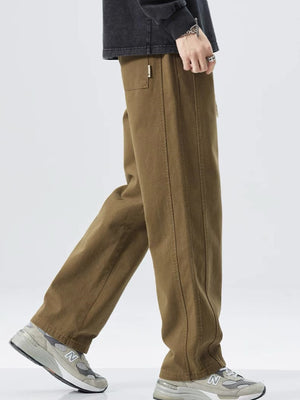 Men's olive loose fit drawstring sweatpants with a relaxed leg and front seam detail.