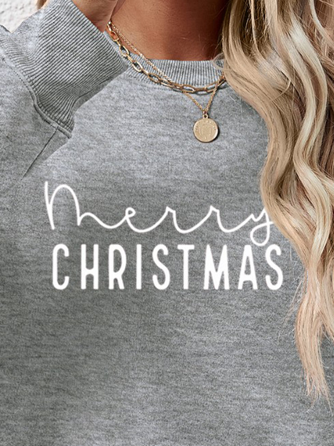 Charcoal Merry Christmas graphic sweatshirt with crewneck and long sleeves.