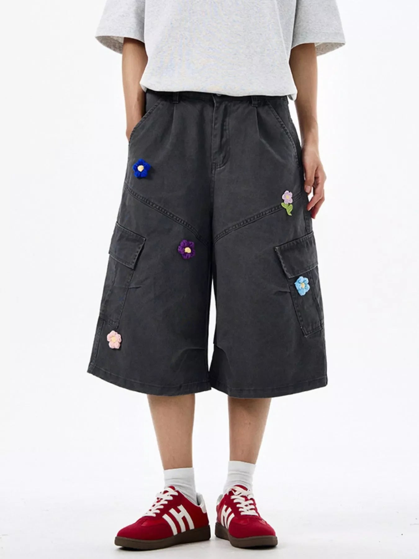 Dark Gray cotton cargo shorts with floral appliques and wide legs.