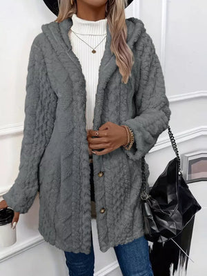Gray hooded teddy coat with button detail and textured fabric.