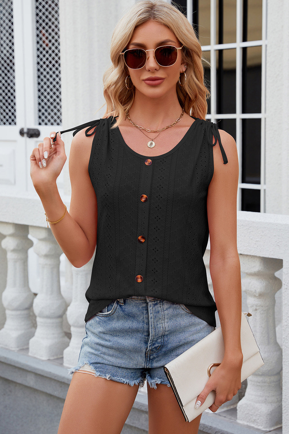 Black eyelet tank top with tie shoulders and button front