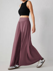 Drape-front wide-leg jersey trousers in Moonlit Mauve with a high waist.