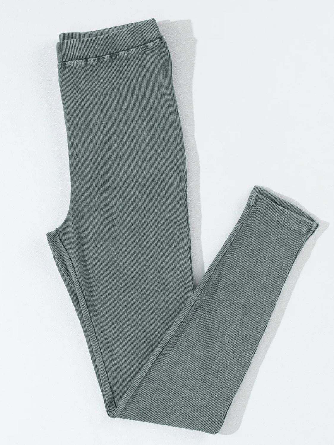 Dark gray ribbed comfort leggings with a textured finish and elastic waistband.