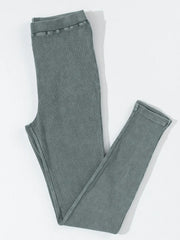 Dark gray ribbed comfort leggings with a textured finish and elastic waistband.