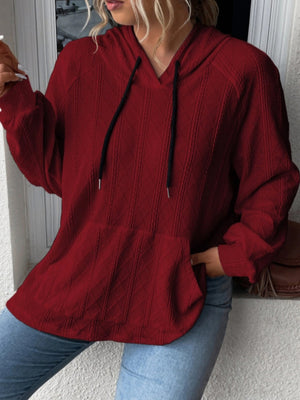 Burgundy textured knit raglan hoodie with drawstring and kangaroo pocket.