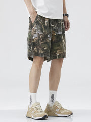 Men's camouflage trunks in Black Forest pattern with drawstring waist and side pockets.